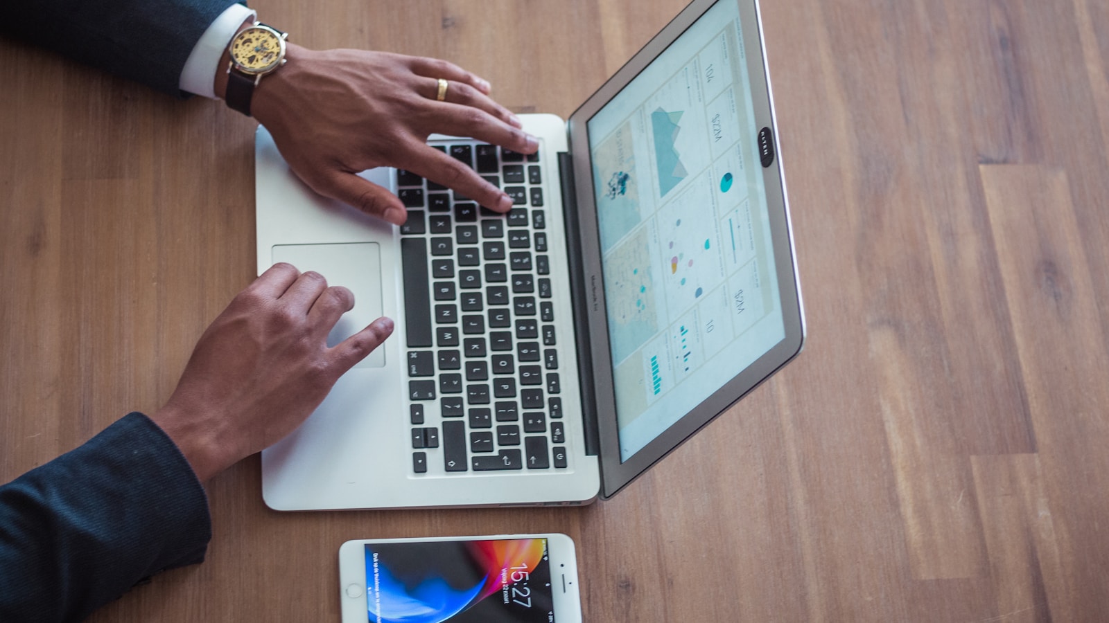 Person using a MacBook Air, reviewing links flagged as risky for a backlink audit