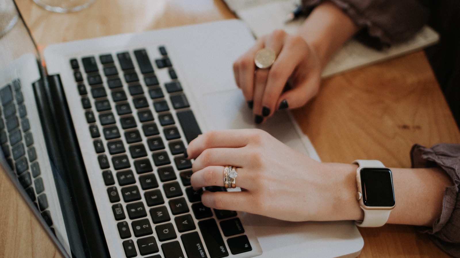 Person using a laptop, checking how relevant a website's links are to its audience
